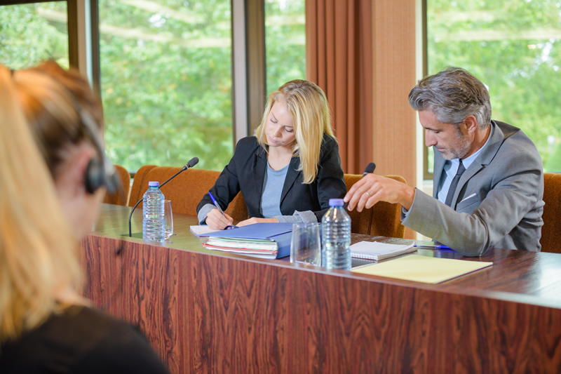 Interpreter at work in small conference setting