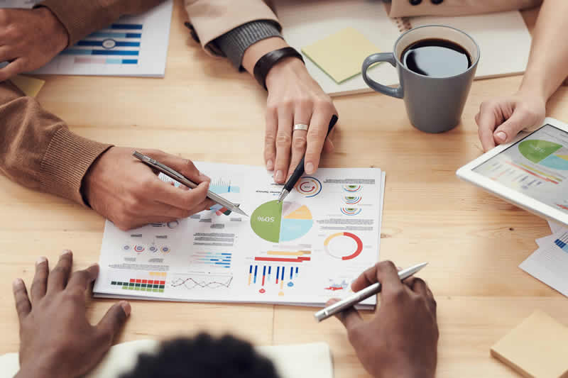 People working with graphs to illustrate scientific translations